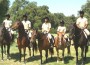 Compton Jr. Posse junior ranger graduating class on horseback in the park.