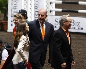 Dale Harvey exits the Del Mar Arena flanked by sponsors.