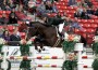 Karl Cook and Johkheer Z fly over a jump at the Las Vegas National Grand Prix.