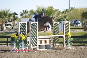 Nick Haness and Cristiano sail over a jump on course.