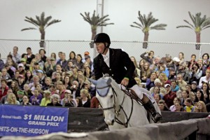 John McConnell rides his magnificent gray horse, Katie Riddle.