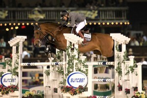 Meredith Michaels-Beerbaum and Cantano soar over a jump.