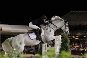 Mane flying, Margie Engle pilots the great gray Indigo over a jump.