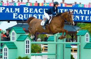 Reed Kessler and Cylana clear a huge green oxer built to a "house" theme.