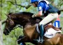 Eventer at the apex of a cross-country jump.