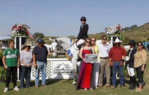 Michelle Paker and Xel Ha accept their trophy.