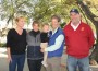 Foursome and baby under the oaks at the Flintridge Riding Club.