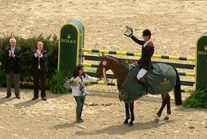 William Fox-Pitt brandishes his Rolex watch at the trophy ceremony.