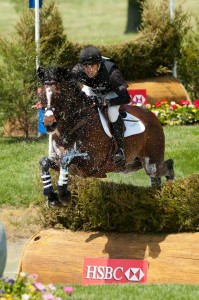 Speeding like a bullet, Jonathan Paget and Clifton Promise leap out of the water covered in spray.