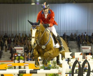 Rich Fellers and Flexible clear a huge, striped jump.