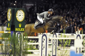 Philipp Weishaupt and his bay horse Monte Bellini clear a huge jump.