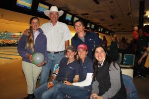 Team McAllister's five members pose with a bowling ball.