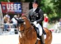 Brian Hafner cuts an elegant figure on his fancy chestnut horse, which has four white socks and four black knees.