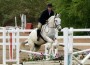 ETI rider Brent Lamb pilots his white mule Dolly over a low crossrails.