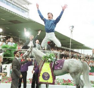 Jocke Frankie Dettori caught mid-air leaping from his horse after a win.