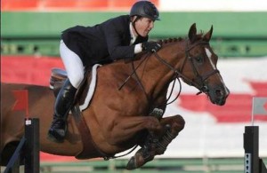 McLain Ward demonstrates classic form as he and Rothchild clear a vertical jump.