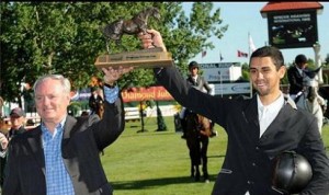 Nayel Nassar hoists a trophy at Spruce Meadows.