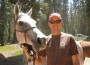 Garrett Ford poses for a close-up with his grey horse, The Fury.