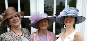 Kate Tweedy, Penny Chenery and Leeann Meadows Ladin pose in elaborate hats.