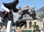 Nick Skelton and his grey gelding Carlo jumping.