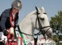 Mounted on horseback, Olivier Philippaerts collects his trophy.