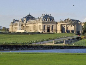 View of the Grand Stables as seen over a river.