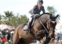 Meredith Michaels-Beerbaum looks stylish in Germany's gray riding attire as she flies over a jump on the bay mare Bella Donna 66.