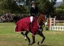 Susan Artes and Zamiro take their victory lap in a crimson cooler.