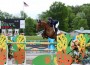 Christine McCrea and Avenir clear a very colorful jump.