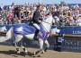 Ben Maher and his grey horse Cella on a victory gallop.