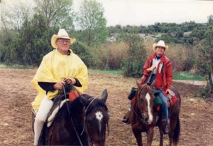 Marc and Royan Herman pose on horseback.