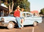 Marc and Royan Herman post near a powder-blue 1950s Chevy.