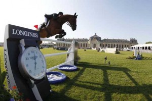 Scott Brash and Hello Sanctos jump with the Living Museum of the Horse in the background