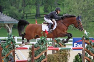 Margie Engle and Royce soar over a jump.