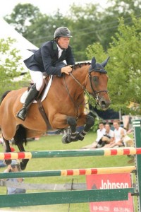 Peter Wilde and the bright chestnut bay Lewin 5 clear a jump.